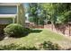 Backyard with a well-maintained lawn and privacy fence, offering a great outdoor living space at 217 Dalmeny Dr, Cary, NC 27513