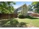 Green backyard with wood privacy fence, plants and lawn area at 217 Dalmeny Dr, Cary, NC 27513