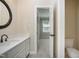 Bathroom with a white vanity, modern fixtures, and adjacent room at 217 Dalmeny Dr, Cary, NC 27513