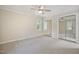 Comfortable bedroom with mirrored closet doors and plenty of natural light at 217 Dalmeny Dr, Cary, NC 27513