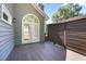 Large deck with architectural arched doors and stylish privacy screen for outdoor gatherings at 217 Dalmeny Dr, Cary, NC 27513