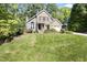 Charming two-story home with a brick facade, well-manicured lawn, and mature landscaping at 217 Dalmeny Dr, Cary, NC 27513