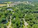 This aerial view captures a community near a pond, shopping, and a hospital, offering convenient access at 221 Antique Lace Way, Holly Springs, NC 27540