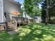 Large, lush backyard with a deck, great for outdoor entertaining at 221 Antique Lace Way, Holly Springs, NC 27540
