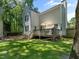 Spacious backyard with a wooden deck, offering a beautiful outdoor space at 221 Antique Lace Way, Holly Springs, NC 27540