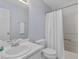 Bright bathroom with a shower and bathtub combination and a sleek white vanity at 221 Antique Lace Way, Holly Springs, NC 27540