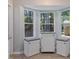 Bright breakfast nook with storage cabinets and view of the backyard at 221 Antique Lace Way, Holly Springs, NC 27540