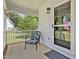 Charming front porch with a seating area, perfect for enjoying quiet moments outdoors at 221 Antique Lace Way, Holly Springs, NC 27540