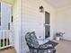 Charming front porch with a seating area, perfect for enjoying quiet moments outdoors at 221 Antique Lace Way, Holly Springs, NC 27540