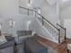 Bright and open living room with a view to the staircase leading upstairs at 221 Antique Lace Way, Holly Springs, NC 27540
