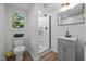 Updated bathroom with a glass-enclosed shower and modern vanity at 2317 Bertie Dr, Raleigh, NC 27610