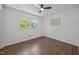 Bedroom with hardwood floors, ceiling fan, and a bright window view at 2317 Bertie Dr, Raleigh, NC 27610