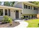 Inviting front entrance with walkway, fresh mulch, plants, and modern paint at 2317 Bertie Dr, Raleigh, NC 27610
