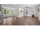Open living space with hardwood floors, modern lighting, large windows and easy access to stairs at 2317 Bertie Dr, Raleigh, NC 27610