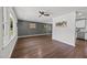 Bright living room with hardwood floors, large windows, ceiling fan, and open layout at 2317 Bertie Dr, Raleigh, NC 27610