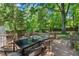 View of large deck in backyard, set up for outdoor dining at 2504 State St, Durham, NC 27704