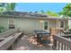 Spacious backyard deck with a bench is perfect for outdoor dining at 2504 State St, Durham, NC 27704