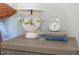 Bedroom featuring wood nightstand with decor, lamp, clock and books at 2504 State St, Durham, NC 27704