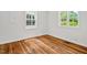 Bedroom showing wood flooring and natural light coming in from the window at 2504 State St, Durham, NC 27704