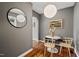 Dining area with modern lighting, stylish seating, and hardwood floors at 2504 State St, Durham, NC 27704