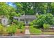 Charming single-story home featuring a well-manicured lawn and inviting front entrance at 2504 State St, Durham, NC 27704