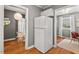 Bright kitchen featuring stainless steel refrigerator, hardwood floors, and stylish decor at 2504 State St, Durham, NC 27704