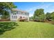 View of the house from the yard showing the deck, back of the house, and a grassy lawn at 2644 Bloomsberry Ridge Dr, Fuquay Varina, NC 27526