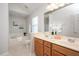 Bathroom with double vanity, large mirror, bathtub and shower at 2644 Bloomsberry Ridge Dr, Fuquay Varina, NC 27526