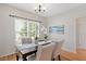 Elegant dining room with hardwood floors, wainscoting, and ample natural light at 2644 Bloomsberry Ridge Dr, Fuquay Varina, NC 27526