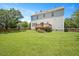 Exterior view of the house featuring a large backyard, deck and partial fence at 2644 Bloomsberry Ridge Dr, Fuquay Varina, NC 27526