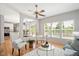 Bright living room with hardwood floors, multiple windows, and an open layout at 2644 Bloomsberry Ridge Dr, Fuquay Varina, NC 27526