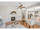 Cozy living room featuring a fireplace, hardwood floors, and an open floor plan at 2644 Bloomsberry Ridge Dr, Fuquay Varina, NC 27526