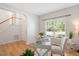 Cozy office space featuring hardwood floors, a large window, and a stylish workspace at 2644 Bloomsberry Ridge Dr, Fuquay Varina, NC 27526