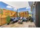 Inviting covered patio with a stylish outdoor seating area and modern privacy screen at 265 Purple Aster St, Youngsville, NC 27596