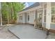 Backyard with a patio and steps leading to a large, fenced-in yard at 3 Waconda Ct, Durham, NC 27713