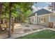 Beautiful backyard featuring a garden, porch swing, manicured lawn, and mature trees at 3 Waconda Ct, Durham, NC 27713