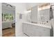 Bathroom boasts a double vanity with granite countertops, a walk-in shower, and access to the main bedroom at 3 Waconda Ct, Durham, NC 27713