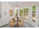 Sunlit breakfast nook with decorative pendant lighting and view of the backyard at 3 Waconda Ct, Durham, NC 27713