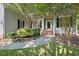 Close-up of the home's entrance with well-manicured landscaping and a welcoming front porch at 3 Waconda Ct, Durham, NC 27713