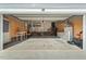 Large, well-lit garage with ample storage space and workbench area; perfect for projects and parking at 3 Waconda Ct, Durham, NC 27713