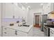 Updated kitchen with stainless steel appliances, white cabinetry, and granite countertops at 3 Waconda Ct, Durham, NC 27713