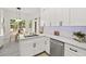 Bright kitchen features granite countertops, stainless steel appliances, and an eat-in breakfast nook at 3 Waconda Ct, Durham, NC 27713