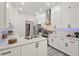 Well-appointed kitchen features granite countertops, subway tile backsplash, and stainless steel appliances at 3 Waconda Ct, Durham, NC 27713