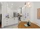 Modern kitchen with white cabinets, granite countertops, and stainless steel appliances at 3 Waconda Ct, Durham, NC 27713