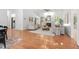 Bright and airy living room featuring hardwood floors, a fireplace, and an abundance of natural light at 3 Waconda Ct, Durham, NC 27713