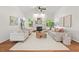 Spacious living room featuring a fireplace, large windows, and comfortable, stylish decor at 3 Waconda Ct, Durham, NC 27713