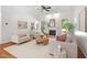 Bright and open living room with a fireplace, hardwood floors, and comfortable seating arrangement at 3 Waconda Ct, Durham, NC 27713