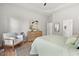 Bright main bedroom boasts hardwood floors and a seating area with ample natural light at 3 Waconda Ct, Durham, NC 27713