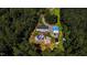 Sprawling estate with a pool, detached garage and a private pond surrounded by lush greenery at 3564 Lower Moncure Rd, Sanford, NC 27330