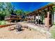 Outdoor living area with a fire pit, deck, and covered space for outdoor gatherings at 3564 Lower Moncure Rd, Sanford, NC 27330